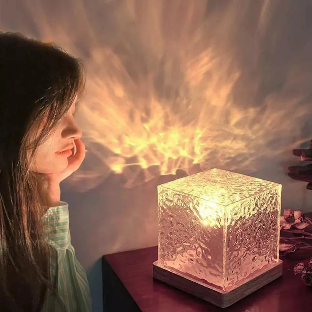 Woman looking at a glowing crystal cube on a table with a warm light