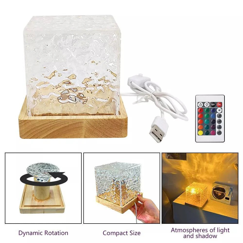 Decorative lamp with wooden base, glass cube, remote control, and USB cable on a white background.