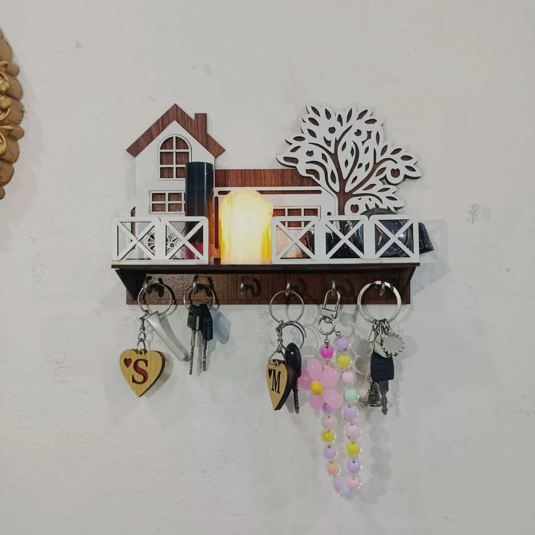 Key holder with decorative items on a white wall