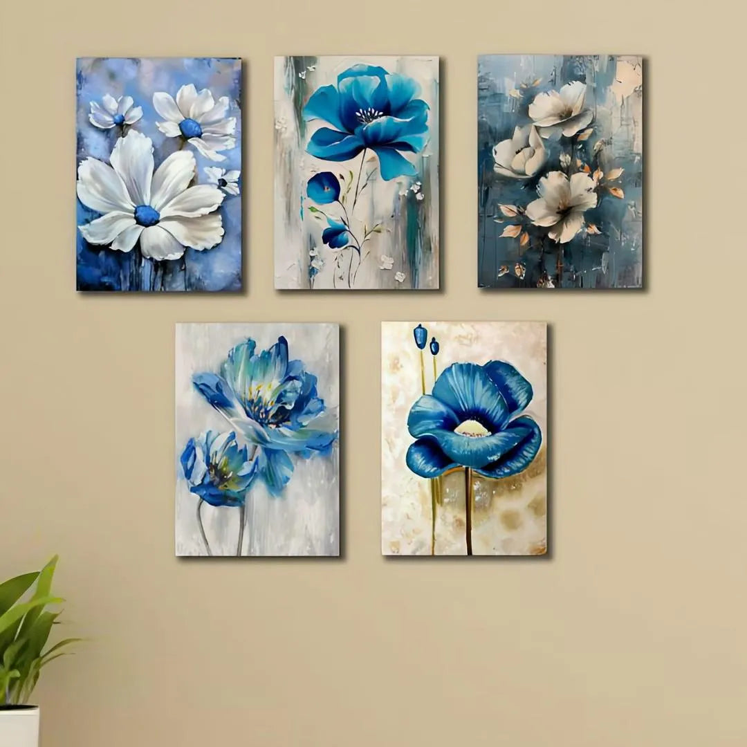 Set of six floral paintings with blue and white flowers on a beige wall.