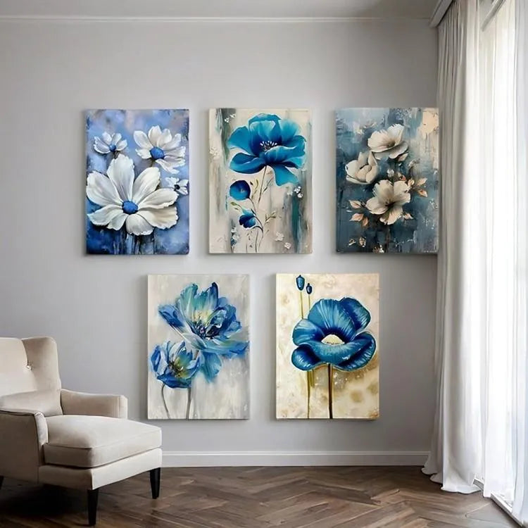 Set of five floral paintings on a wall with a chair and window in the background