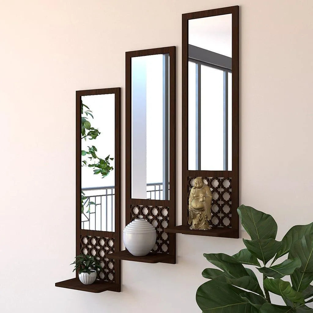 Decorative wall mirrors with shelves and a Buddha statue on a light beige wall.