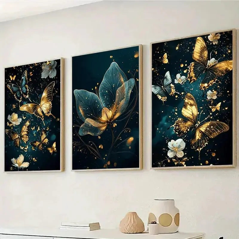 Three framed artworks with butterfly designs on a wall.
