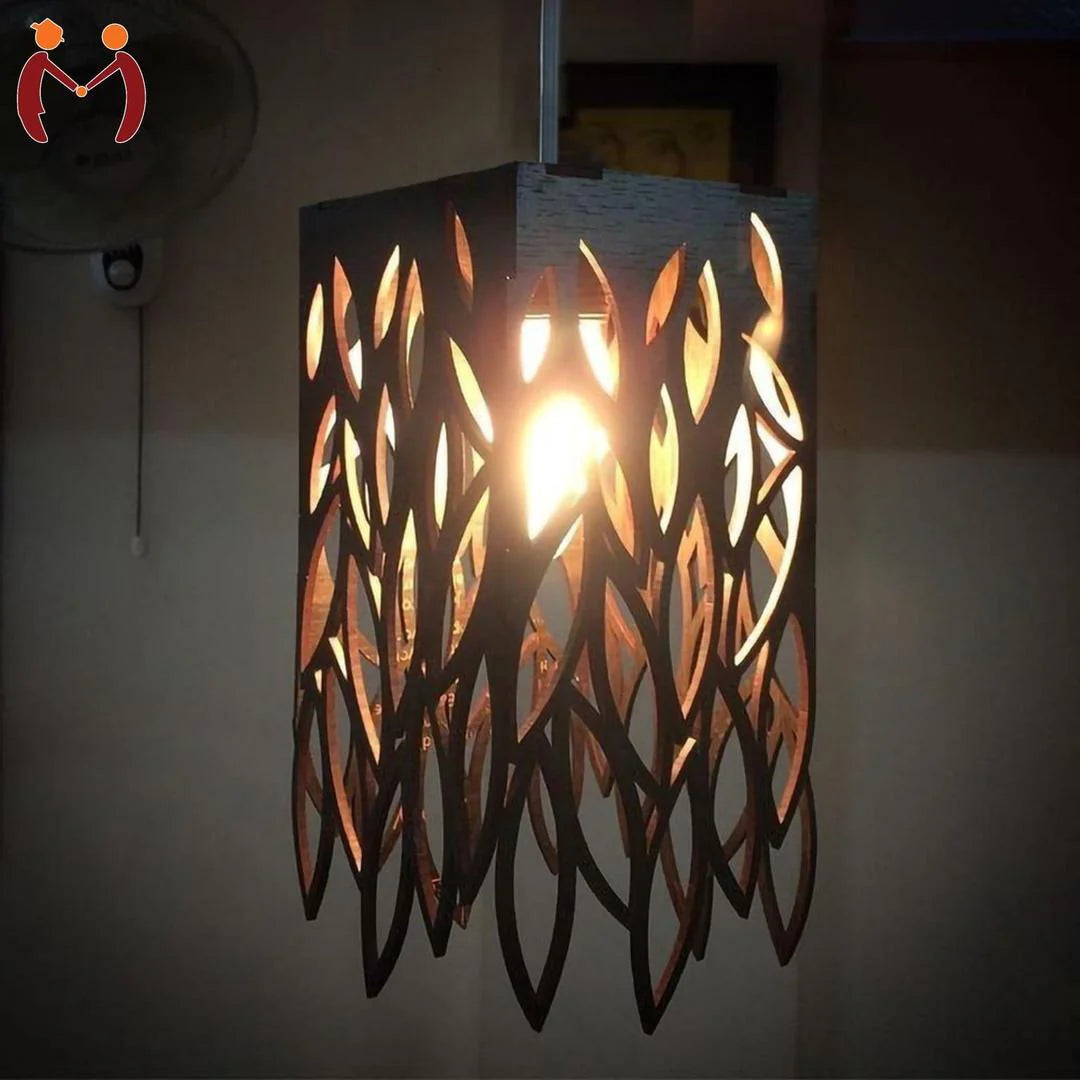 Decorative wall light fixture with leaf-like patterns on a dark background