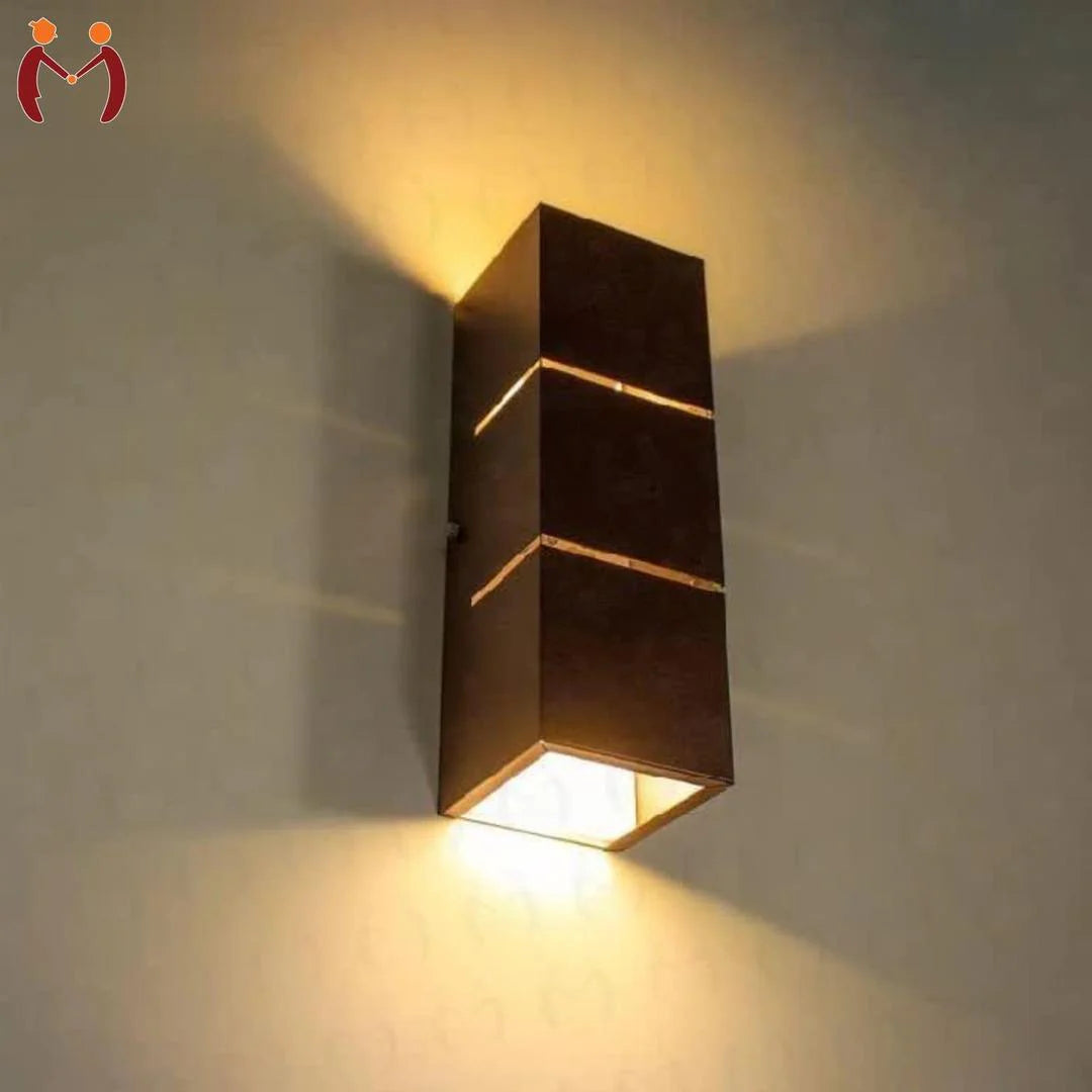 Modern wall-mounted light fixture on a textured wall