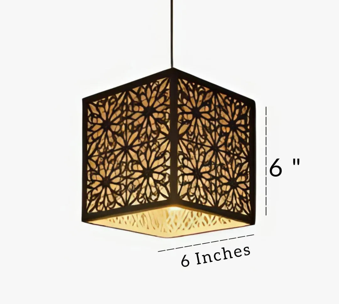 Hexagonal pendant light with floral cutout design and dimensions indicated on a white background