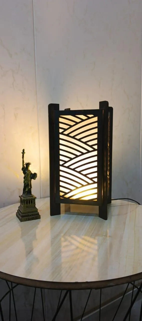 Decorative lamp with wavy pattern on a marble surface