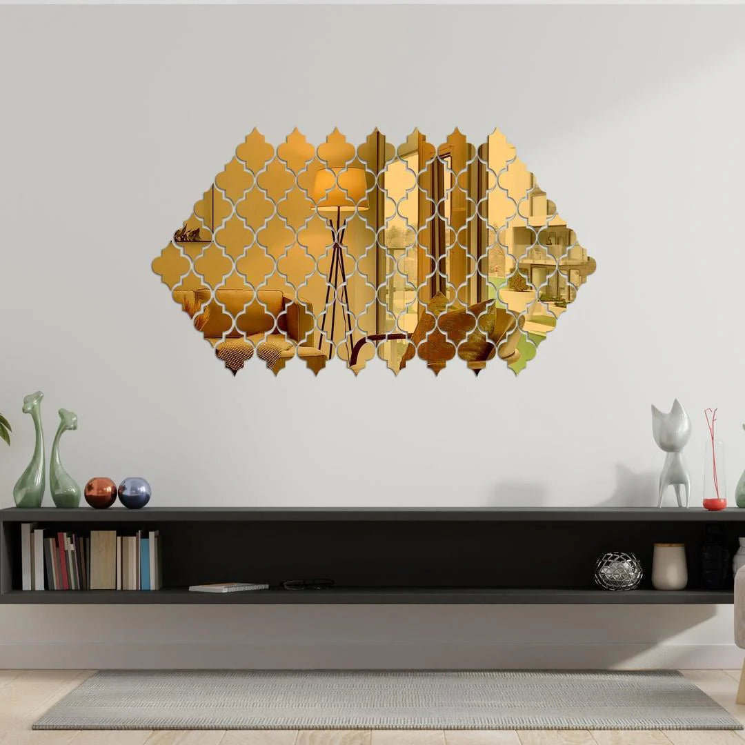 Decorative gold wall mirror with geometric pattern in a living room setting.