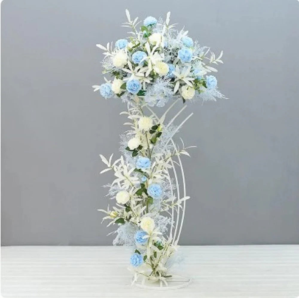 Decorative floral arrangement with blue and white flowers on a gray background