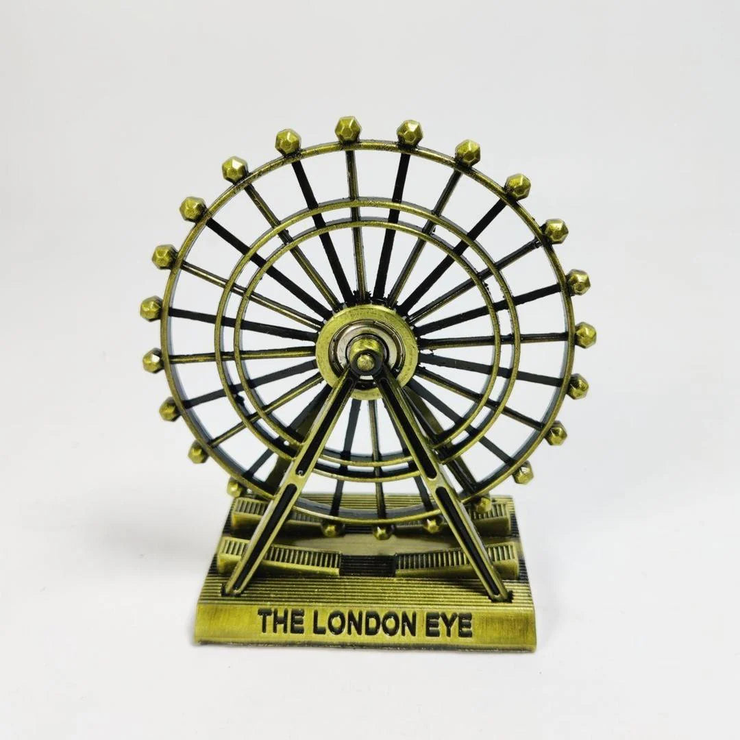 Bronze-colored model of the London Eye on a white background