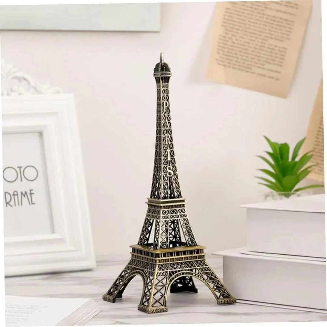 Model of the Eiffel Tower on a white surface with a light background