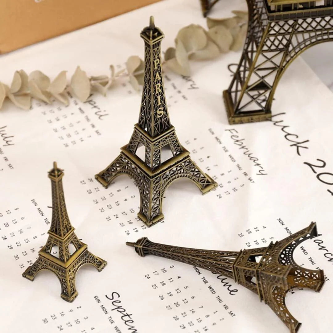Small bronze Eiffel Tower models on a calendar