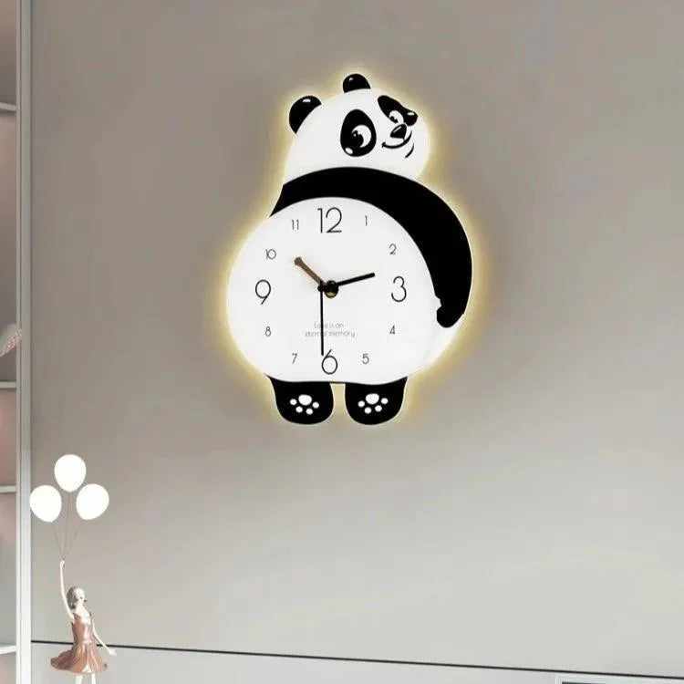 Panda-shaped wall clock with glowing effect on a plain wall