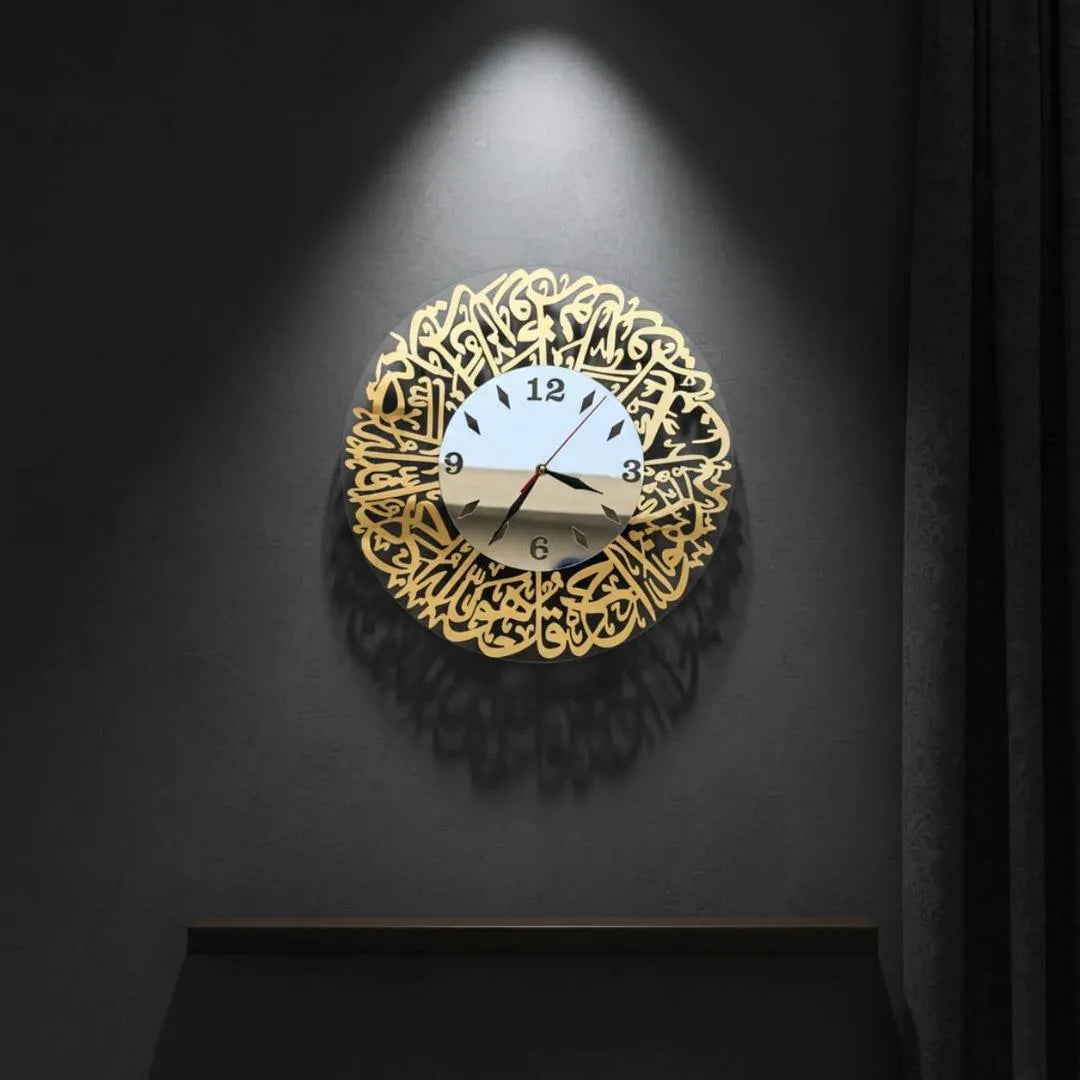 Decorative wall clock with gold intricate design on a dark background