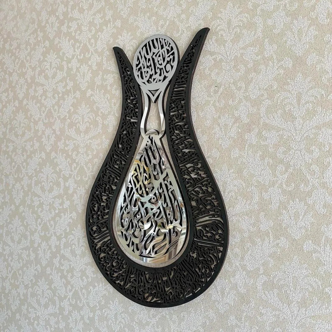 Decorative metal wall art with intricate designs on a beige background