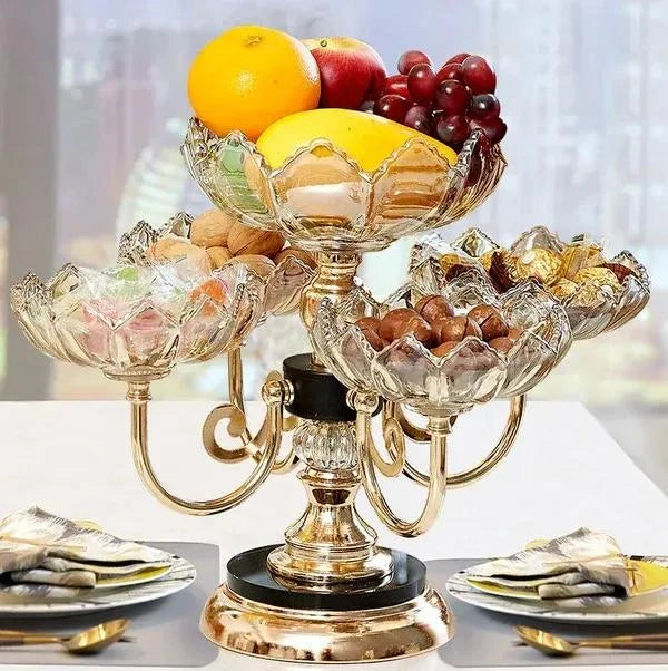 Decorative fruit bowl stand with fruits on a blurred background