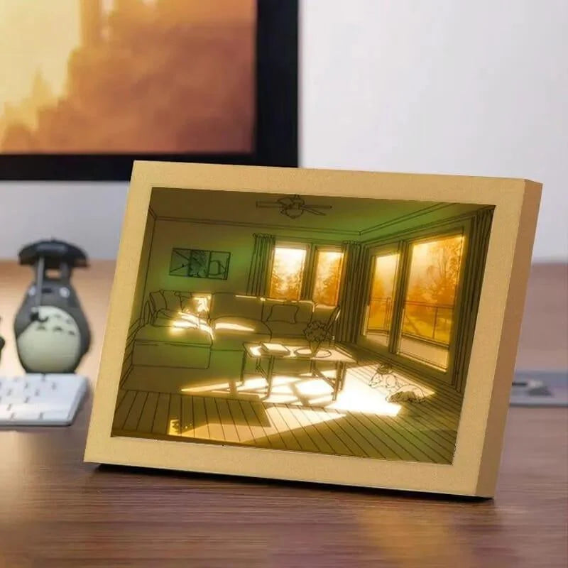 3D paper model of a living room scene on a desk
