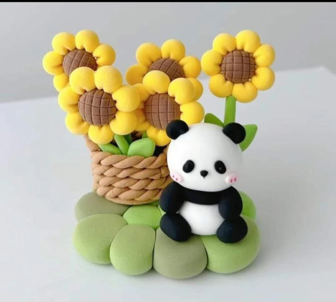 Model of a panda with sunflowers and a basket on a white background
