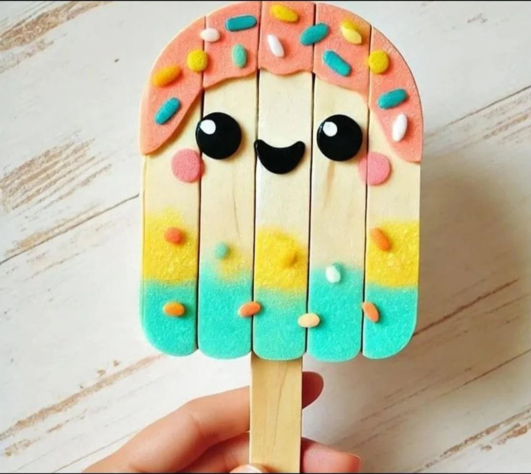 Colorful popsicle-shaped cookie with a face on a wooden surface
