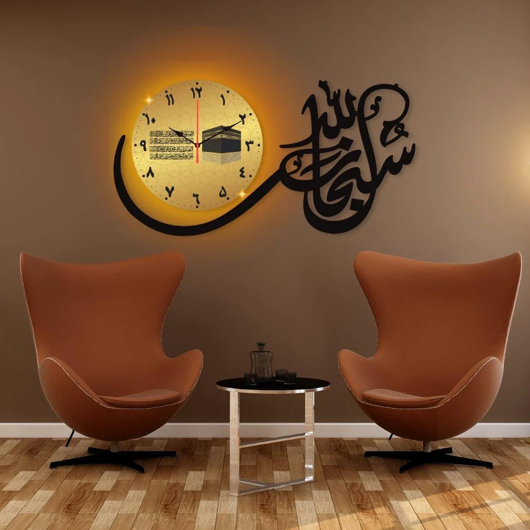 Decorative wall clock with Arabic calligraphy in a room with two orange chairs and a small table.
