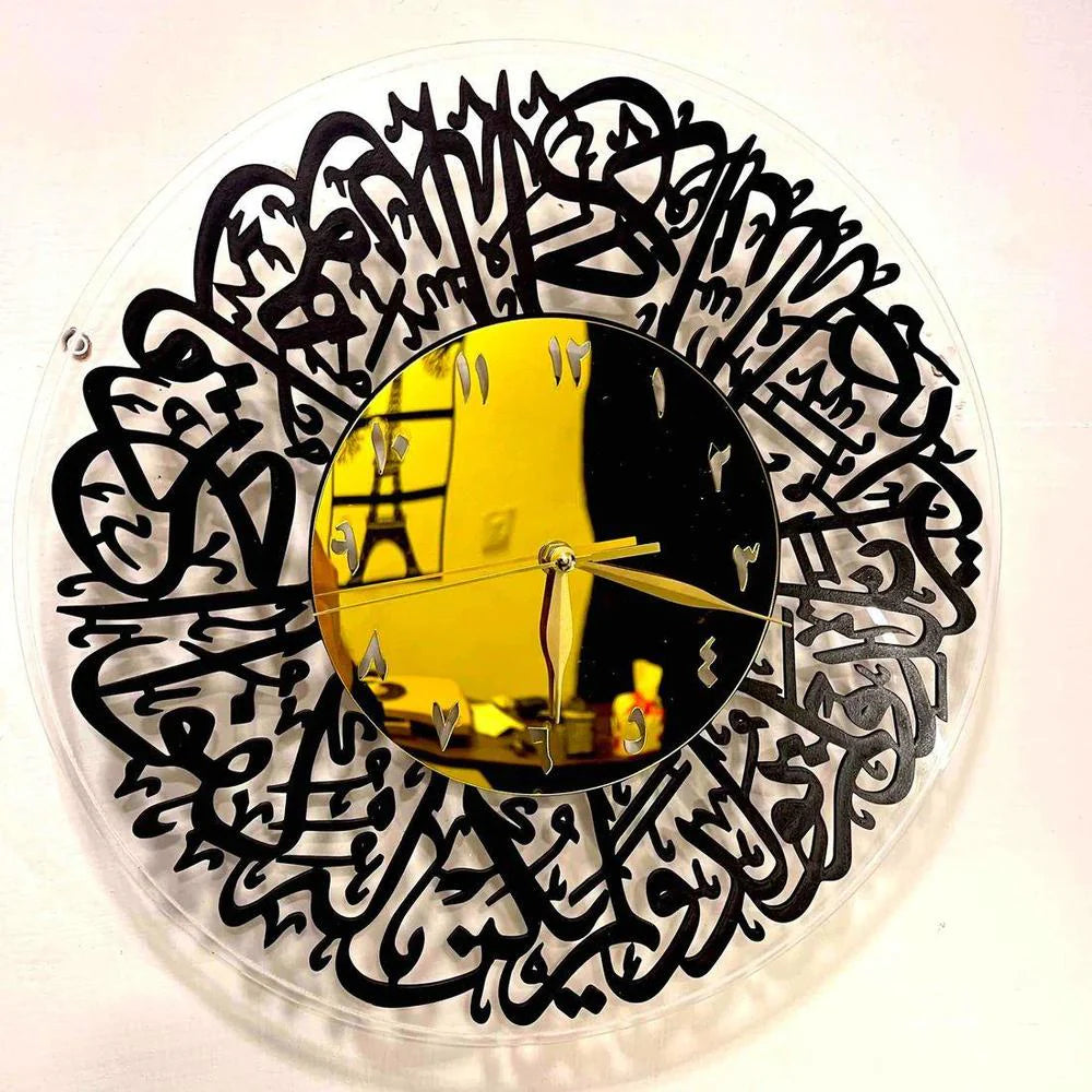 Decorative wall clock with black Arabic calligraphy design on a white background