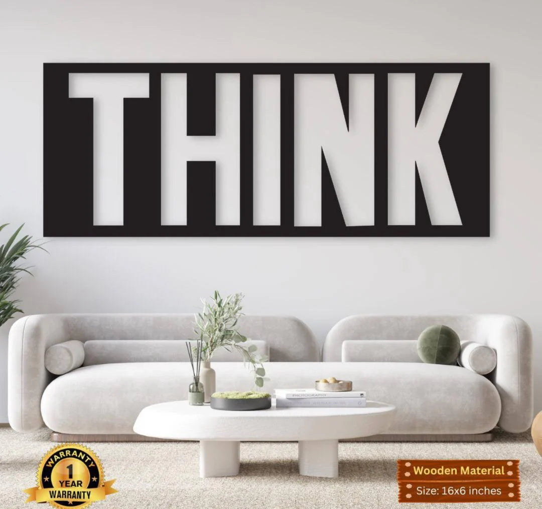 Wall art with the word 'THINK' in a modern living room setting.