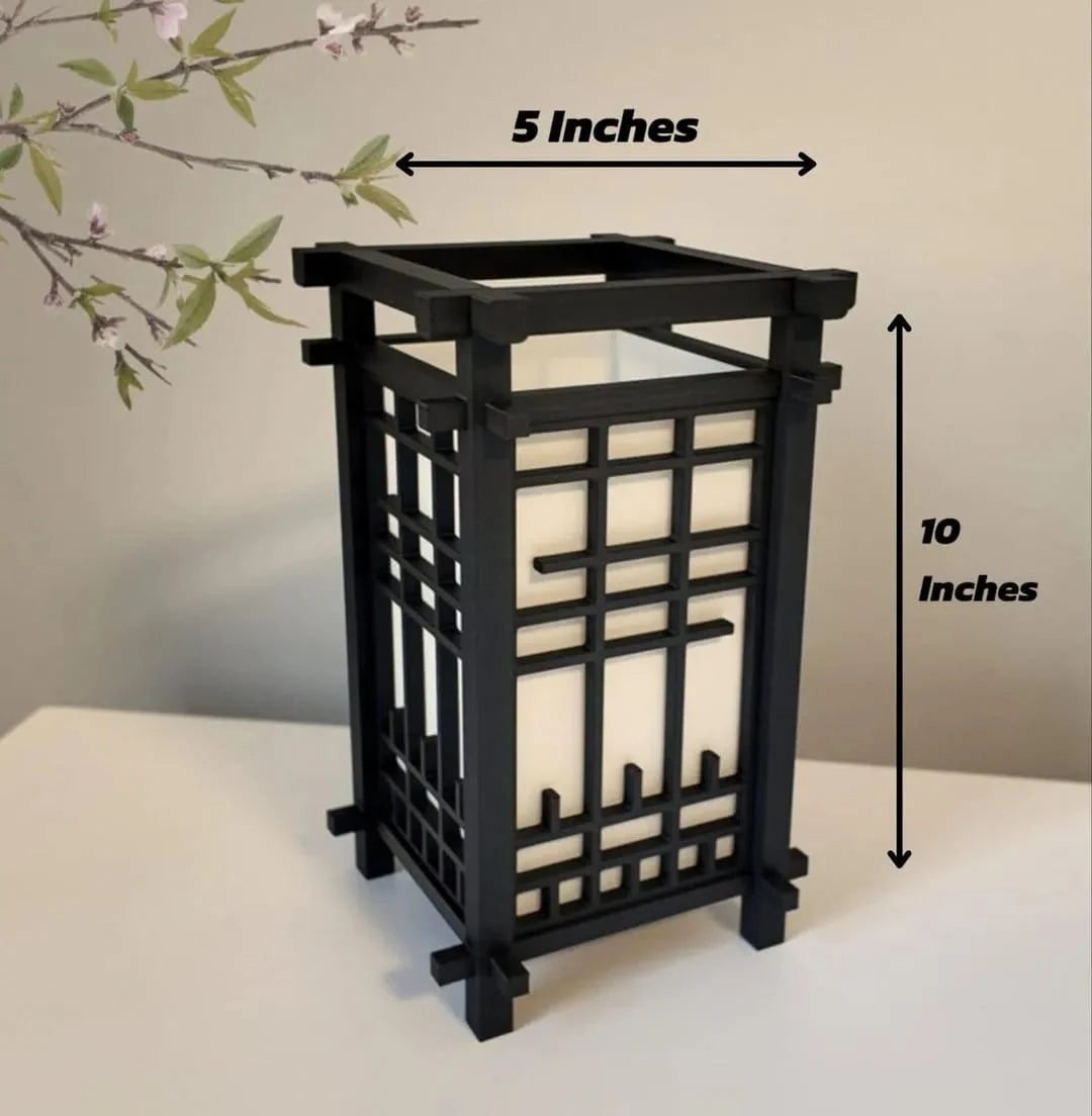Black decorative lantern with measurements on a neutral background